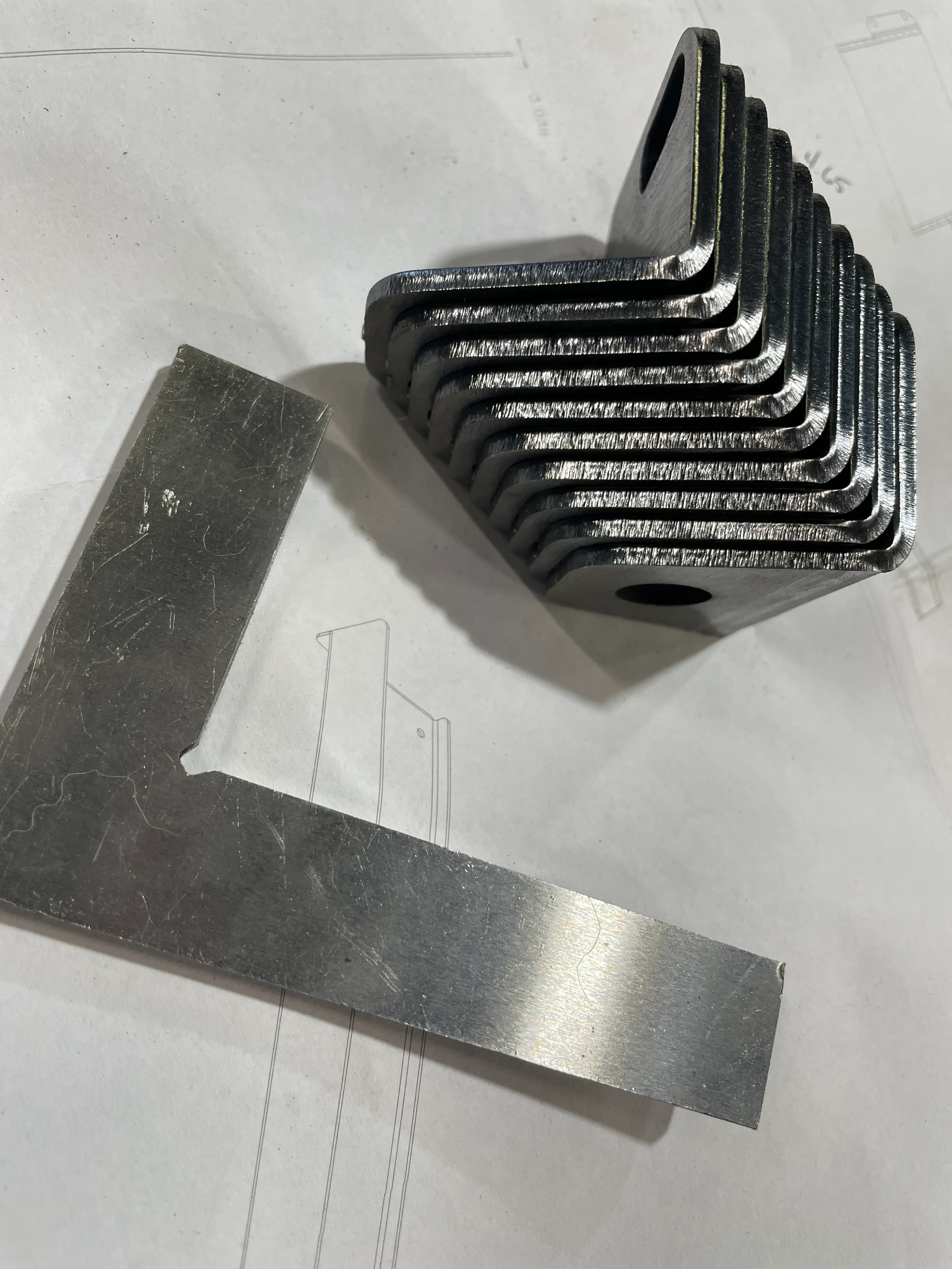Laser cut and formed brackets on top of engineering drawing